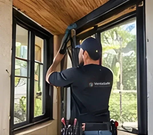 Installer checking the window opening