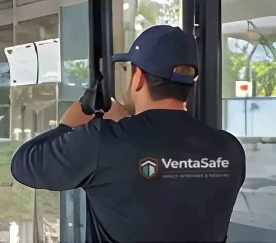 Installer setting a new impact window