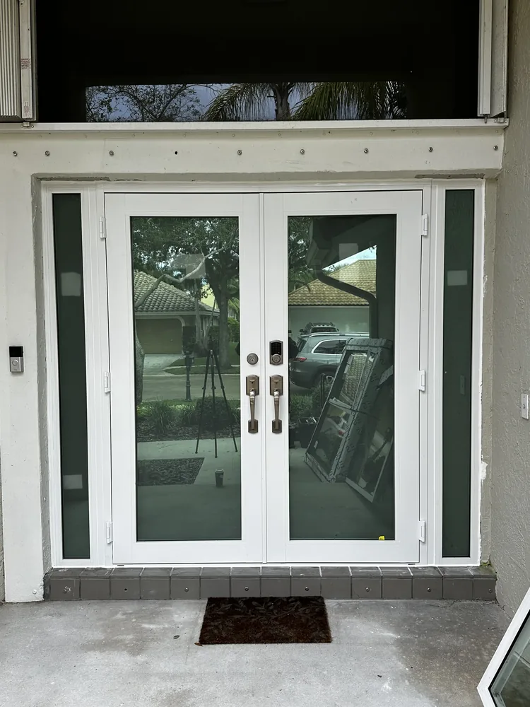 Finished white impact double door with sidelights